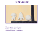 Size guide graphic showing the astronaut, rocket and planet next to a ruler
