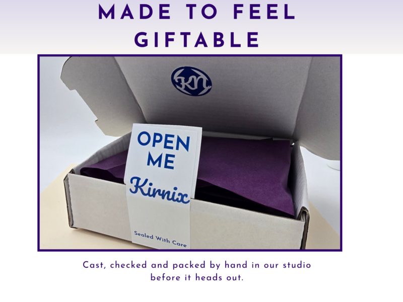 Gift-ready packaging graphic showing an open box with purple tissue and an “Open Me Kirnix” sticker