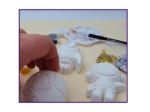 Video thumbnail image showing a close-up of the space kit contents with a hand holding one blank shape