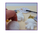 Video thumbnail image showing a close-up of the space kit contents with a hand holding one blank shape