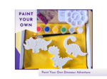 Boxed paint your own dinosaur craft kit with three blank dinosaur figures, paint pots, glitter and palette