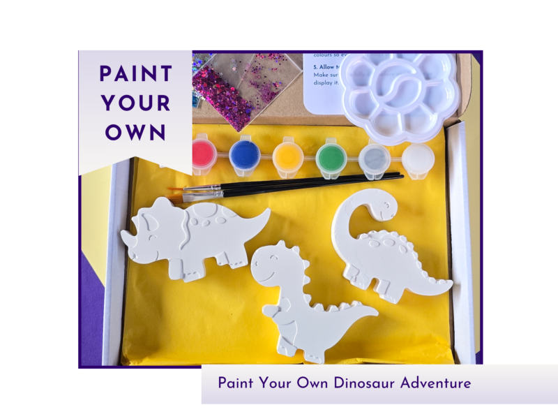Boxed paint your own dinosaur craft kit with three blank dinosaur figures, paint pots, glitter and palette