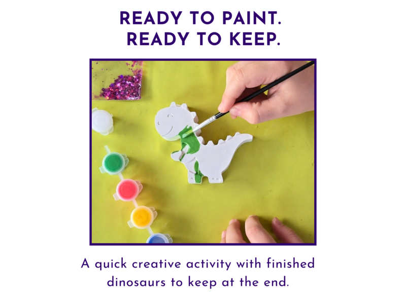 Child painting a blank dinosaur figure from the paint your own dinosaur kit