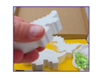 Video thumbnail showing the boxed dinosaur kit with blank figures and paint supplies