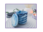 Blue and white marbled storage pot with the lid resting beside it on a striped surface