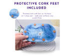 Underside of the blue marble oval tray showing four protective cork feet.