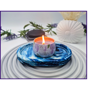 Small oval blue and white marbled tray styled with a candle and neutral décor