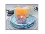 Small blue and white marbled oval catchall tray styled with a candle on a ribbed grey mat
