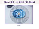 Small oval marbled tray shown with a £1 coin for size scale