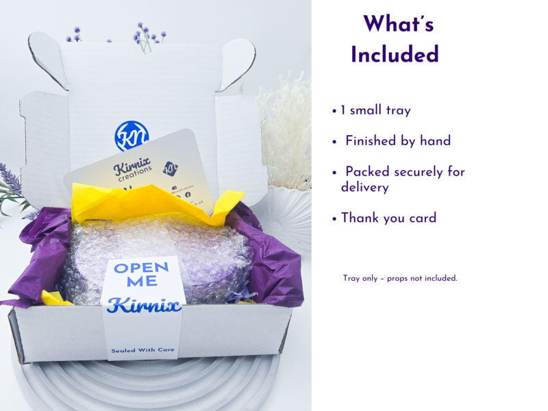 Open white gift box with purple tissue, bubble wrap, and a Kirnix branding card inside, showcasing packaging contents.