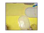 Video still showing an oval tray being removed from its mould on a yellow work surface