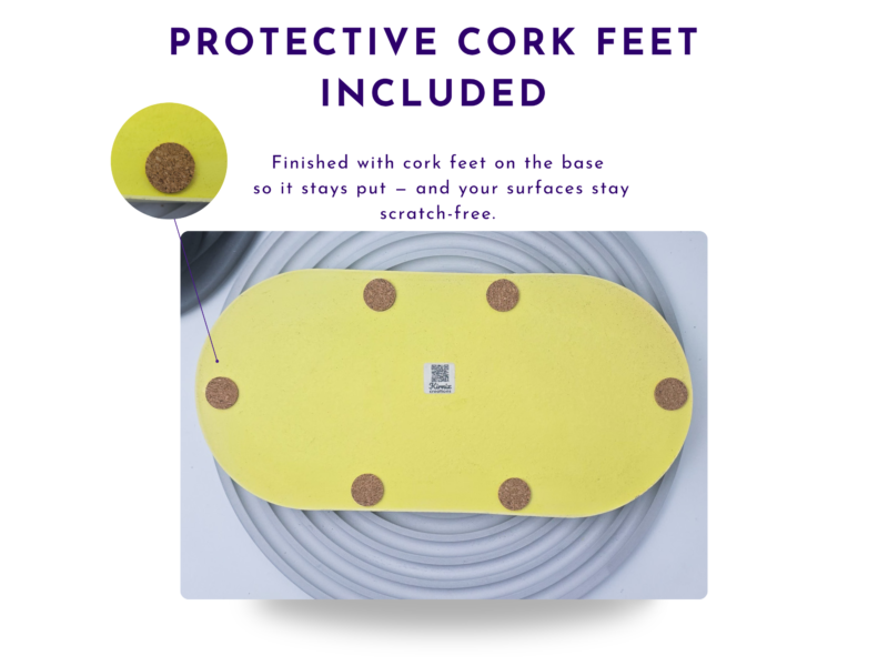 Underside of a yellow oval tray showing the protective cork feet