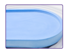 Close-up of a blue oval tray showing the smooth finish and curved edge