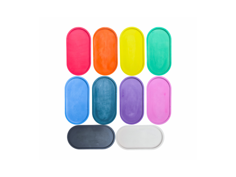 Studio swatch image showing ten oval trays in different solid colours.