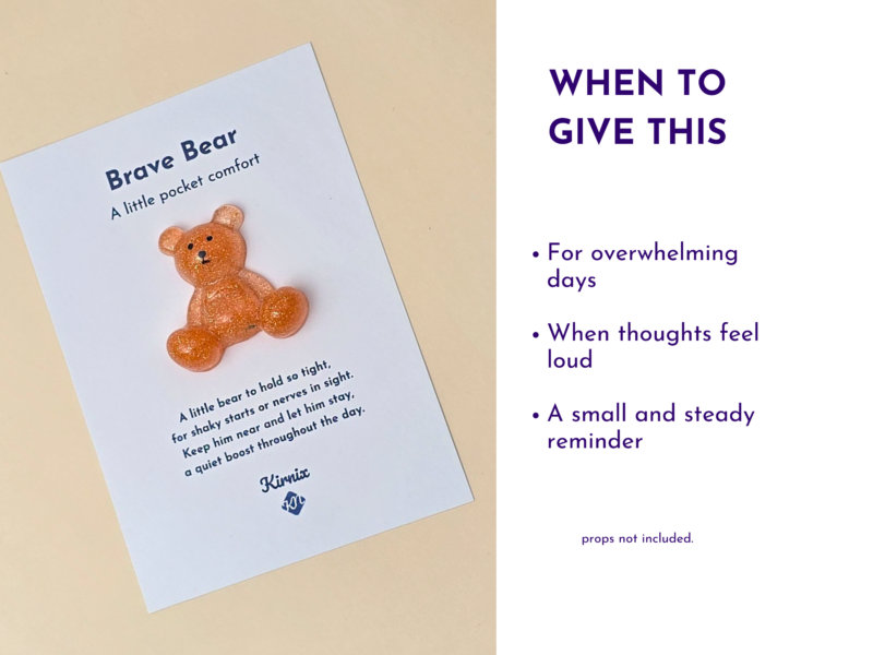 Informational graphic: a card titled Brave Bear with a glittery orange bear illustration; on the right, a 'When to give this' tips list about overwhelming days, loud thoughts, and a steady reminder (props not included).