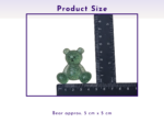 Small green speckled teddy bear beside a ruler, showing it is about 5 cm by 5 cm