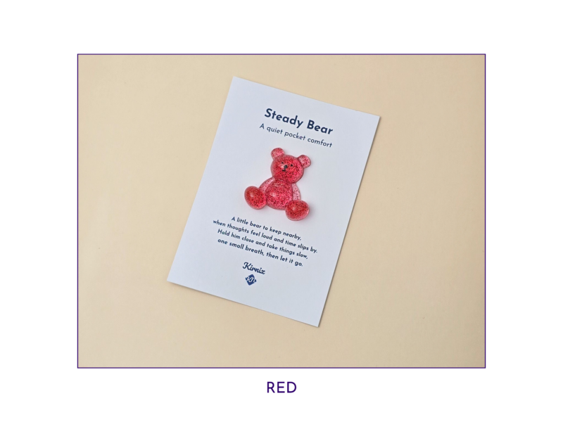 Steady Bear glitter pocket companion in red on its printed support card.