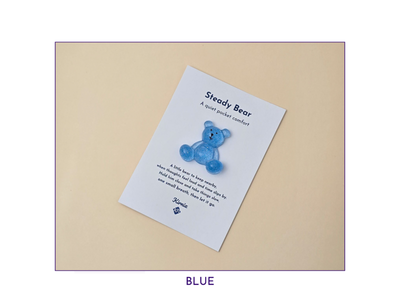 Steady Bear glitter pocket companion in blue on its printed support card.