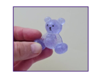and holding the Steady Bear glitter pocket companion to show scale, finish, and how it looks in real use.