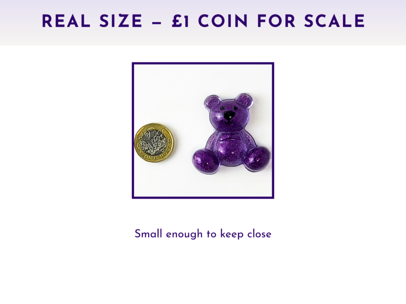 Worry Bear pocket companion shown with £1 coin for scale