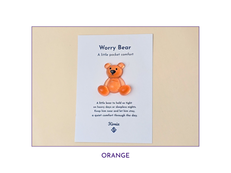 Orange Worry Bear pocket companion on backing card