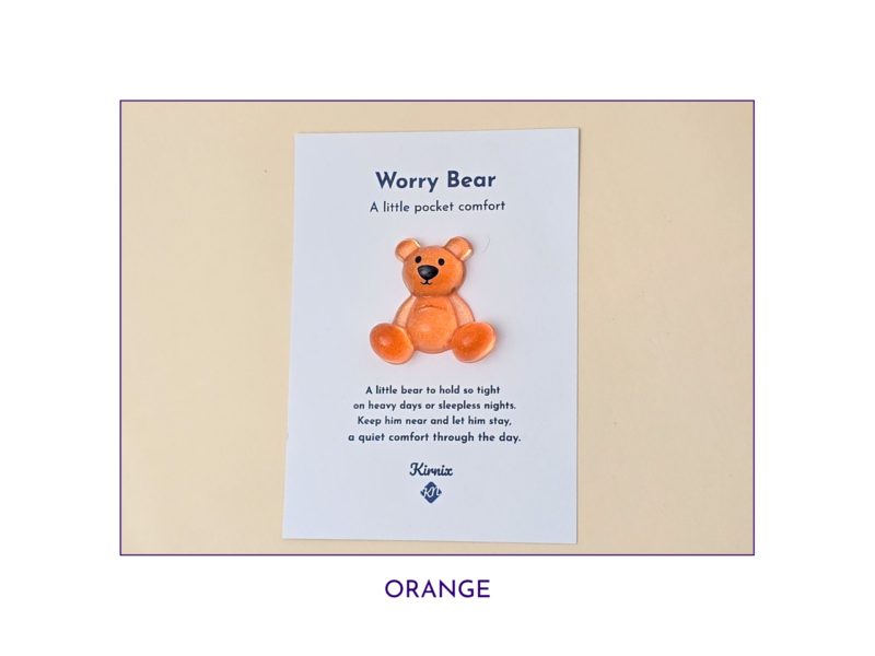 Orange Worry Bear pocket companion on backing card