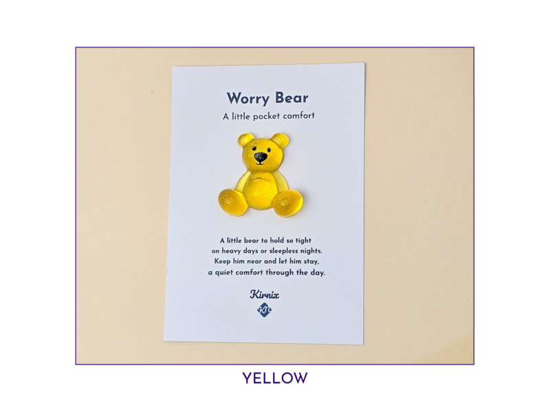 Yellow Worry Bear pocket companion on backing card
