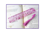 KXK-RBMK-02 Open book showing text about the Second Age, with a pink glittery bookmark and tassel laid across the pages.
