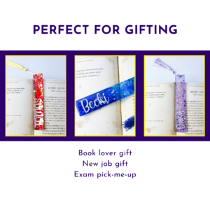 Three book-themed gifts with colorful tassels displayed in yellow frames against a purple background.