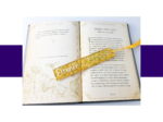KXK-RBMK-11 Open fantasy book showing two pages with decorative borders and a glittery gold bookmark crossing the pages. The heading reads 'ANNATAR, LORD OF GIFTS'.