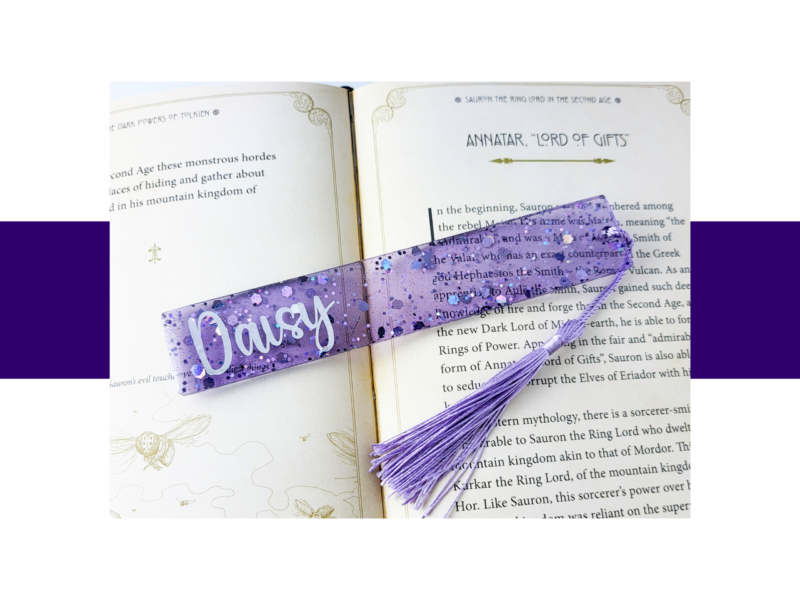 Open book showing the chapter title 'Annatar, Lord of Gifts' with a purple glitter bookmark crossing the pages.