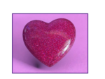 Glittery pink heart against a soft purple background