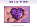 Scale Glitter resin pocket hug heart held in an open palm showing actual pocket size — approximately 5cm