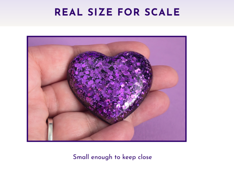 Scale Glitter resin pocket hug heart held in an open palm showing actual pocket size — approximately 5cm