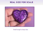 Scale Glitter resin pocket hug heart held in an open palm showing actual pocket size — approximately 5cm