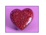 Glittery pink heart against a purple background (valentine theme).