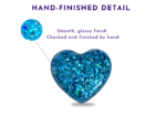Blue glitter heart with a smooth, glossy finish, indicating hand-finished detail.