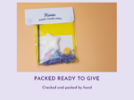 KNP-PYO-BEARS-mini_077. Gift-ready Packaged paint-your-own craft kit with assorted paints and a white molded object on a yellow background.