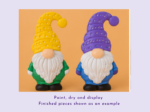 KNP-PYO-GNOMEs-0033. Painted result Two whimsical gnome figurines with dotted hats—one yellow and one purple—standing side by side against an orange background, decorative display pieces.