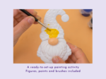 KNP-PYO-GNOMEs-0066. Main benefit Hands paint a white gnome figurine with yellow on an orange surface, using a brush.