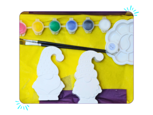 Hero image: Boxed paint your own gnome craft kit with two blank AquaCast gnome figures, eight paint pots, brushes and palette.