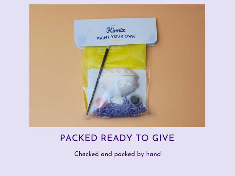 Gift-ready DIY paint-your-own kit in a clear bag with purple tissue and a white top label reading 'Packed Ready to Give' below the image text.