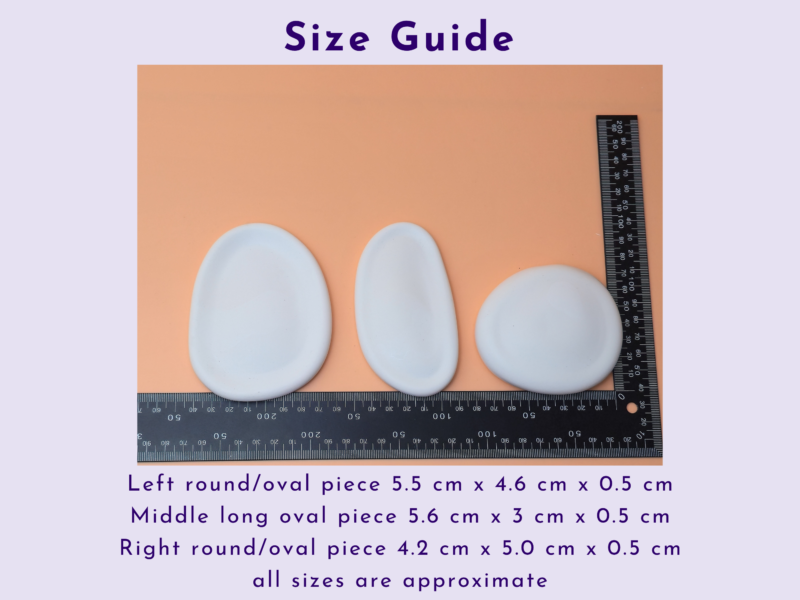 Size guide image showing a ruler beside three white oval ceramic pieces on a peach background