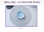 Small decorative pot shown from above with a £1 coin for size scale