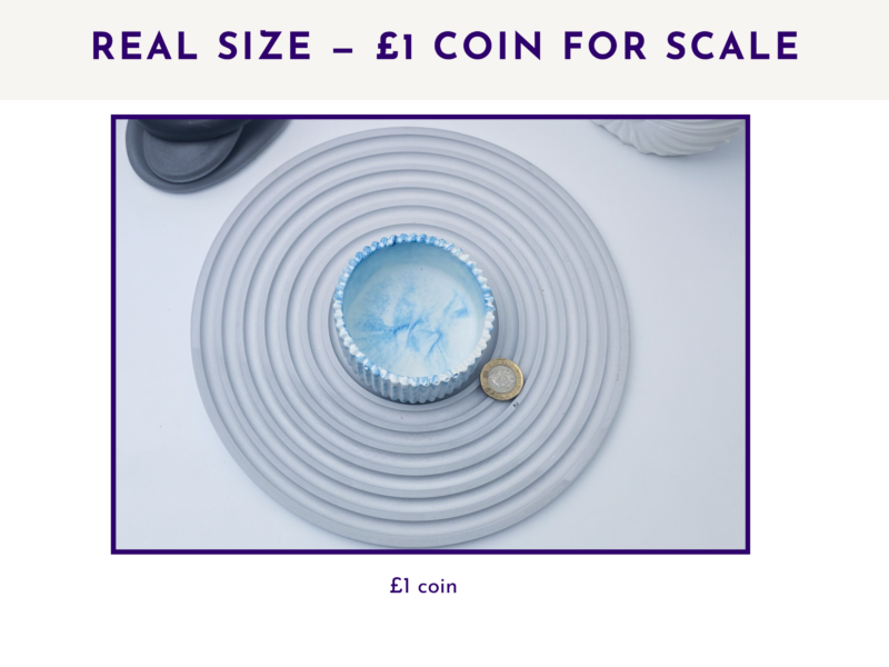 Small decorative pot shown from above with a £1 coin for size scale