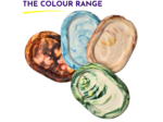 Overlapping marbled discs in blue, brown, green, and beige beneath the heading 'THE COLOUR RANGE'.