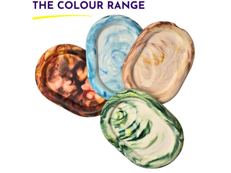 Overlapping marbled discs in blue, brown, green, and beige beneath the heading 'THE COLOUR RANGE'.