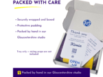 Graphic showing a 'PACKED WITH CARE' heading beside a partially opened cardboard box with packing slips and a 'Thank you' card inside.