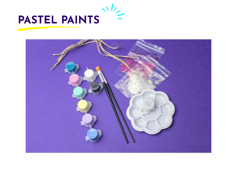 Brand header 'PASTEL PAINTS' with blue sun motif above colorful paint supplies on a purple background: glitter bags, brushes, and pastel pots.
