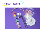 Paint supplies spread on a purple background: small paint pots, brushes, glitter in zip bags, and a white plastic palette with compartments.